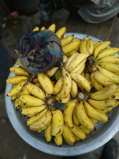 yellow banana fruit on gray steel bowl